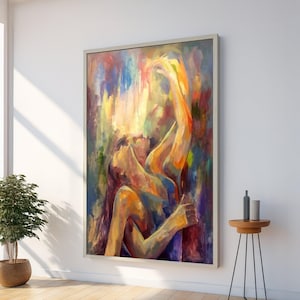Puede incluir: Pintura al óleo abstracta sobre lienzo que representa dos figuras abrazándose, con los brazos levantados. La obra de arte presenta una vibrante paleta de colores que incluye azules, amarillos, naranjas y rojos. La pintura está enmarcada.