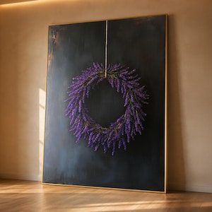 May include: A large rectangular painting in a thin gold frame featuring a circular wreath of vibrant purple lavender flowers suspended by a single thin string against a dark, textured, charcoal-coloured background with subtle bronze highlights.