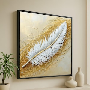 May include: A framed canvas print depicting a large white feather with a gold central vein. The background is a blend of gold and cream tones with textured brushstrokes and sparkling accents. The artwork is encased in a black frame.