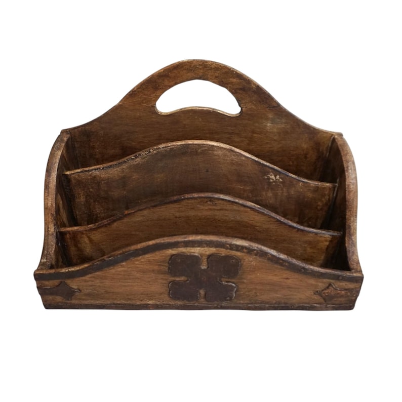 May include: A wooden desk organizer with a handle, featuring three compartments. The organizer has a dark brown finish with decorative details, including a four-leaf clover design and star-shaped accents.