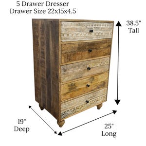 May include: A five-drawer dresser made of light brown wood with carved details. The dresser is 97.8 cm tall, 63.5 cm long, and 48.3 cm deep. The drawer size is 55.9x38.1x11.4 cm. The text "5 Drawer Dresser" is visible.