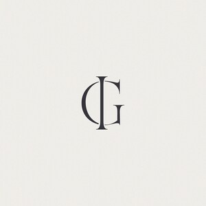 May include: A monogram logo with the letters "IG" in a simple, modern font.