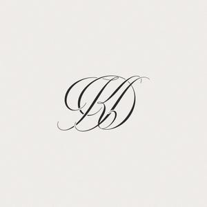 May include: Elegant black monogram featuring the intertwined letters "B" and "D" in a flowing, calligraphic script. The design is set against a soft, off-white background, creating a classic and sophisticated aesthetic.