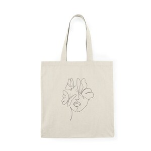 Borsa tote con faccia di farfalla