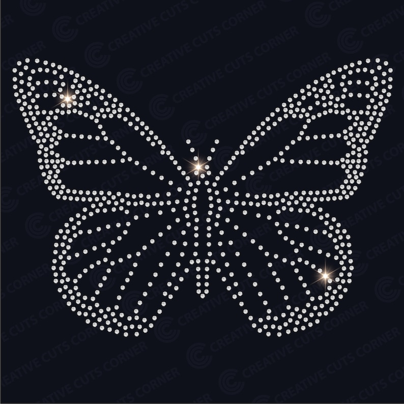 May include: A silver butterfly design made of rhinestones on a black background.