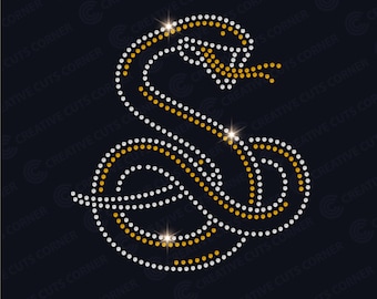 May include: A snake design made of rhinestones, with a gold and silver color scheme. The snake is curled up in a coil shape, with its head raised and its tongue sticking out.