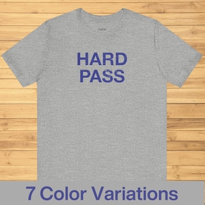 May include: A gray t-shirt with the words "HARD PASS" printed in blue on the front.