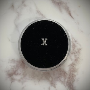 Silver “X” Tooth Gem