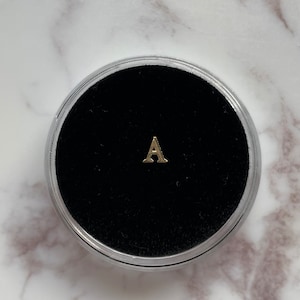 Gema de dente “A” de ouro