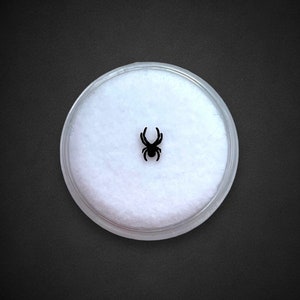 Gema de dente de aranha preta