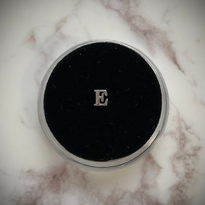 Silver “E” Tooth Gem