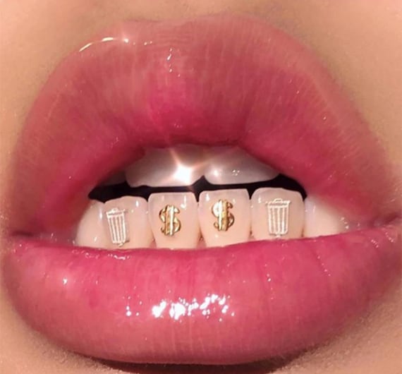 Gold Dollar Sign Tooth Gem