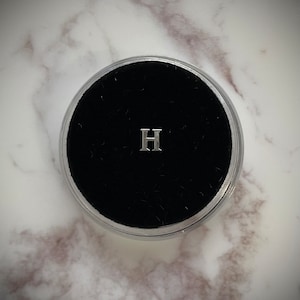 Gema de dente de prata “H”