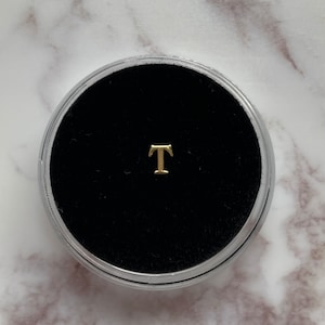 Gold “T” Tooth Gem