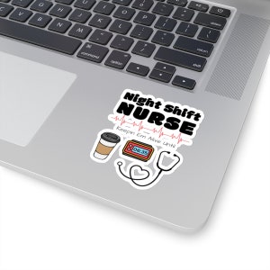 May include: A sticker with the text "Night Shift NURSE" in black and white, with a heartbeat line. Includes a coffee cup, a digital clock showing 06:35, and a stethoscope. The phrase "Keepin Em Alive Until" is also present.