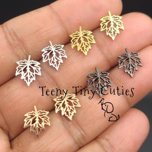 Mini Maple Leaf Stud Earrings Pair: Unisex Push Backs, Stainless Steel in Gold, Silver, Black, and Rose Gold.