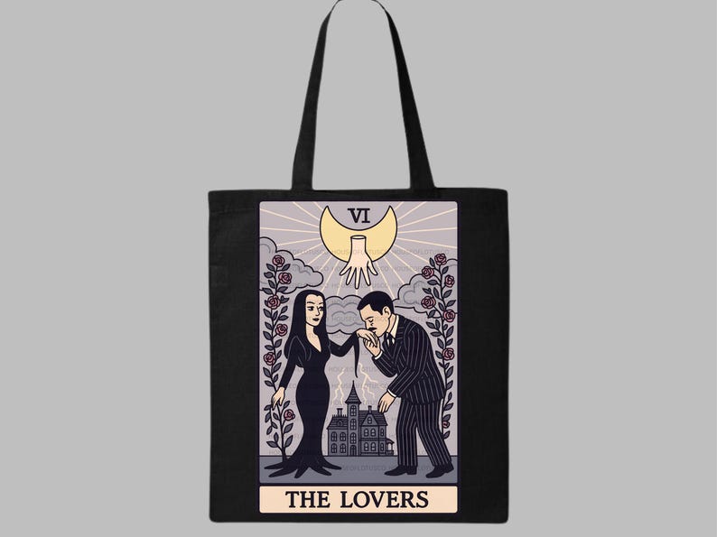 Organic cotton tote bag with The Lovers tarot card design inspired by Morticia & Gomez Addams. Gothic artwork with crescent moon, roses, and haunted mansion. Perfect for Halloween, witchy fashion, and gothic romance fans. Handmade canvas tote featuring The Lovers tarot artwork inspired by Morticia & Gomez Addams. Gothic romance illustration with crescent moon and roses. Ideal spooky tote for Halloween and Addams Family lovers.