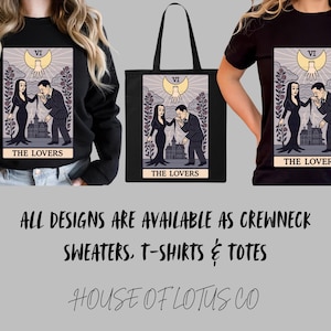 Gothic romance tote bag featuring The Lovers tarot design inspired by Morticia & Gomez Addams. Haunted mansion art with roses and moon. Perfect for Halloween fashion and witchy gothic style. Canvas tote bag with Morticia & Gomez Addams inspired tarot art. Gothic cartoon The Lovers design with roses, moon, and mansion. Ideal for dark romantic and spooky aesthetic fans.