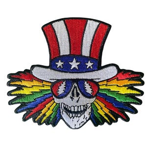 May include: Embroidered patch featuring a skull wearing a top hat with red and white stripes and a blue band with three stars. The skull has sunglasses and colorful lightning bolt accents in rainbow colors.
