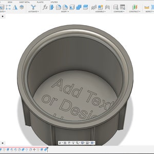 May include: A 3D model of a cup with a gray, textured surface. The inside of the cup has the text "Add Text or Design" engraved on the bottom.
