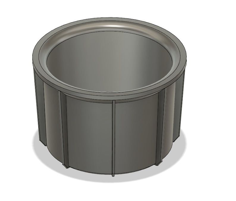 May include: A gray plastic planter with a round top and a cylindrical shape. The planter has a smooth, slightly textured surface.