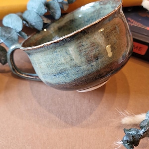 Hand thrown porcelain iron glazed teacup