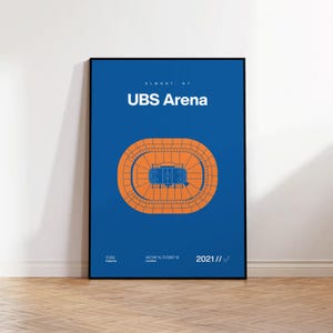 May include: A framed poster with a blue background features the text "ELMONT, NY" and "UBS Arena" in white. An orange diagram of the arena's layout is centered below the text. The bottom of the poster includes the capacity, location, and the year 2021.