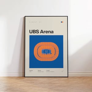 May include: A framed poster featuring a minimalist architectural diagram of the UBS Arena in Elmont, NY. The design includes a blue square with an orange seating bowl and hockey rink, text details for capacity, opening date, and coordinates.