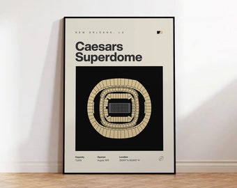 May include: A framed poster featuring the Caesars Superdome in New Orleans. The poster has a black frame and a beige background with the stadium's architectural layout in gold. Text includes "Caesars Superdome" and other details.