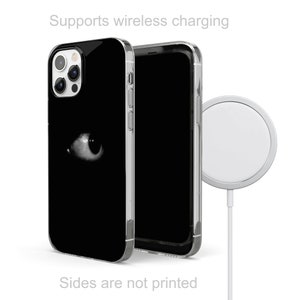 May include: A black phone case with a white eye graphic. The case is compatible with wireless charging. The phone case is shown next to a wireless charging pad.