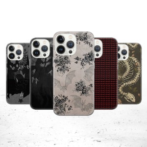 May include: Four different phone cases with various designs. The first case features a black and white illustration of three witches. The second case features a black and white illustration of a figure in a long robe. The third case features a beige background with black bats and floral designs. The fourth case features a dark green background with a skeletal snake and floral designs.