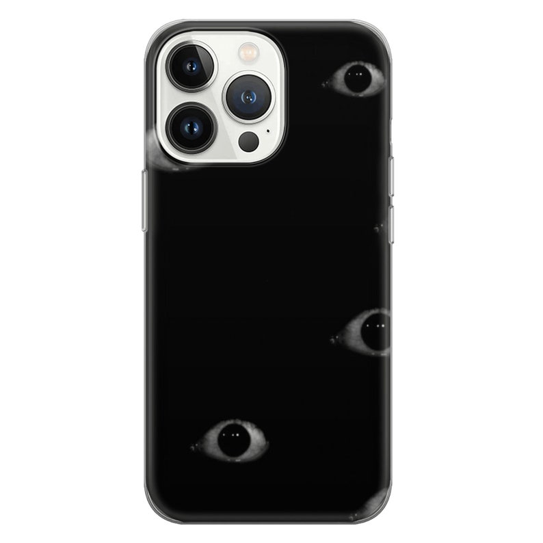 May include: A black phone case with a repeating pattern of white eyes. The phone case is designed for an iPhone 14 Pro Max.