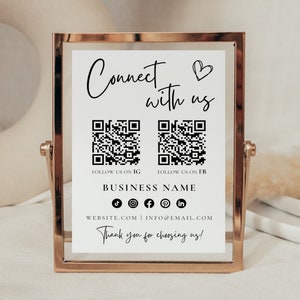 以下が含まれることがあります： 「Connect with us」と書かれた、黒文字とQRコードがついた白い看板。看板には、「FOLLOW US ON IG」、「FOLLOW US ON FB」、「BUSINESS NAME」、「WEBSITE.COM | INFO@EMAIL.COM」、「Thank you for choosing us!」の文字も書かれている。看板は金色の枠に入っている。