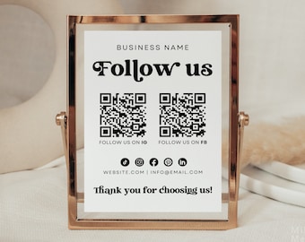 May include: A gold-framed sign with the text "BUSINESS NAME Follow us" and two QR codes. The text "FOLLOW US ON IG" and "FOLLOW US ON FB" are below the QR codes. Social media icons for TikTok, Instagram, Facebook, Pinterest, and LinkedIn are below the text. The text "WEBSITE.COM | INFO@EMAIL.COM" is below the icons. The text "Thank you for choosing us!" is at the bottom of the sign.