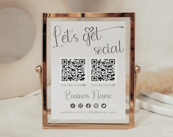 May include: A gold-framed sign with the text "Let's get social" and two QR codes. The sign also includes the text "Follow us on FB" and "Follow us on IG" and the business name. Social media icons for TikTok, Instagram, Facebook, Pinterest, and Twitter are also included, along with the website and email address.