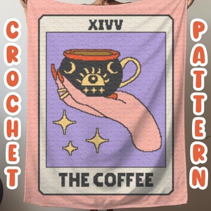 May include: A pink crochet blanket with a tarot card design featuring a black coffee cup with a crescent moon and eye design. The card reads "XIV THE COFFEE".