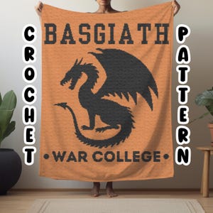 May include: Orange crochet blanket with a black dragon and the text "BASGIATH WAR COLLEGE" in black.