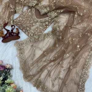 May include: A set of three ceramic mugs with a speckled, matte finish. Each mug is a different colour: light blue, cream, and grey. The mugs have a simple, modern design and a comfortable handle.