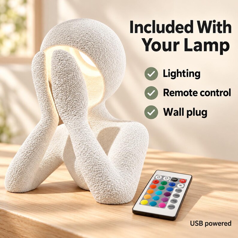 Graphic reading Included With Your Lamp, listing Lighting, Remote control and Wall plug, with a USB powered note, showing the matte textured white sculpture lamp and a colorful remote on a wooden table.