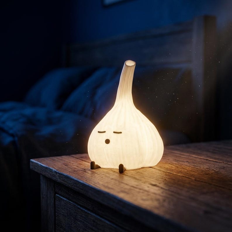 Warm glowing garlic lamp on a wooden bedside table in a dark bedroom