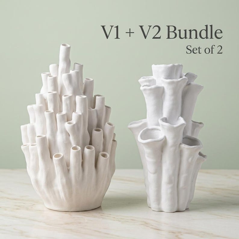 Two matte white textured coral vases side by side under a "V1 + V2 Bundle, Set of 2" label. Sculptural vase pair with branching openings, each about 7.2 in tall.