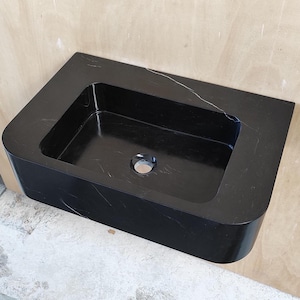 Lavabo de mármol negro: lavabo flotante Nero Marquina