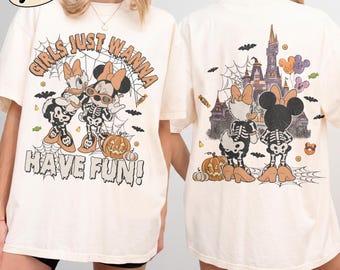May include: An ivory t-shirt featuring a front graphic of Daisy and Minnie Mouse in skeleton costumes with spiderwebs, pumpkins, and the text "GIRLS JUST WANNA HAVE FUN!" and a back graphic of the characters facing a castle with balloons.