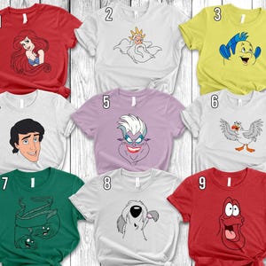 Puede incluir: Una colección de nueve camisetas de manga corta en varios colores, cada una con un personaje de dibujos animados diferente de una película popular. Las camisetas son rojas, blancas, amarillas, verdes y moradas, con ilustraciones de personajes en blanco y negro.