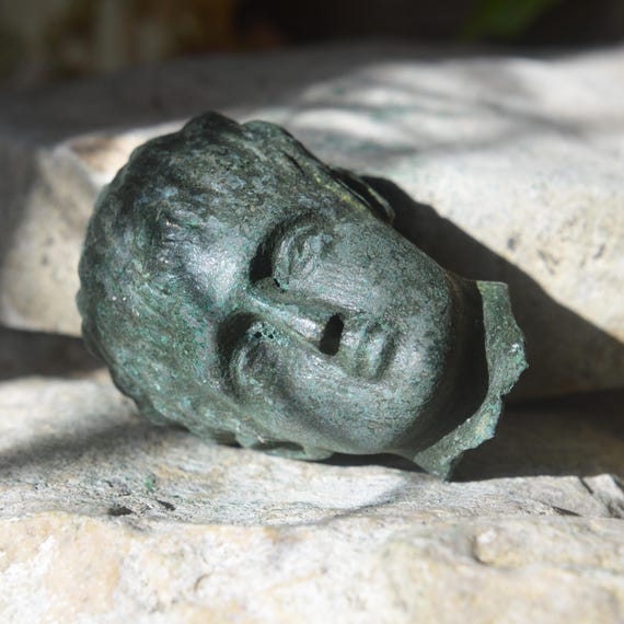 Roman Bronze Head of God Fragment