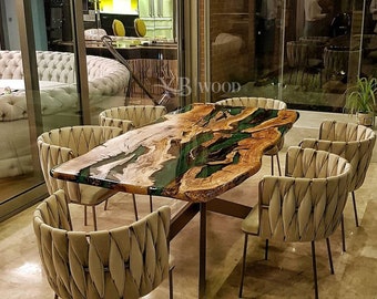 May include: A custom-made dining table with a live edge wooden top, featuring a green and brown epoxy resin inlay. The table is surrounded by six beige upholstered chairs with a unique quilted design. The table is supported by a dark metal base. The logo "YB WOOD" is visible.