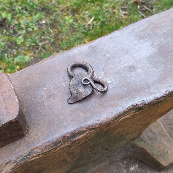 Hand-forged leaf pendant. Forged from mild steel. Broad leaf, ornate stem, messing finish