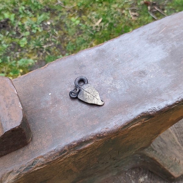 Smaller Forged leaf pendant. Hand-forged from mild steel. Smaller form, ornate stem, messing finish