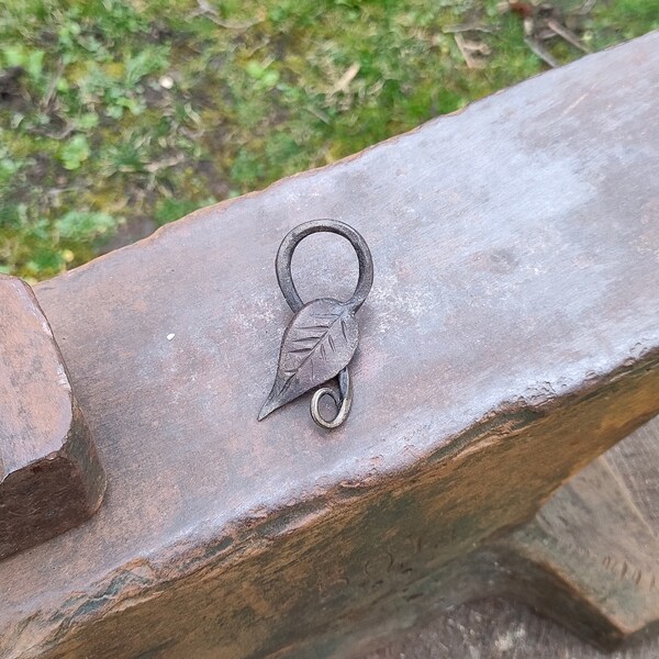 Hand-forged leaf pendant. Forged from mild steel. ornate stem, slim form, messing finish