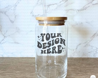 May include: A clear glass jar with a bamboo lid and a straw. The jar has a design that says "YOUR DESIGN HERE" in a retro font with stars on either side of the text.